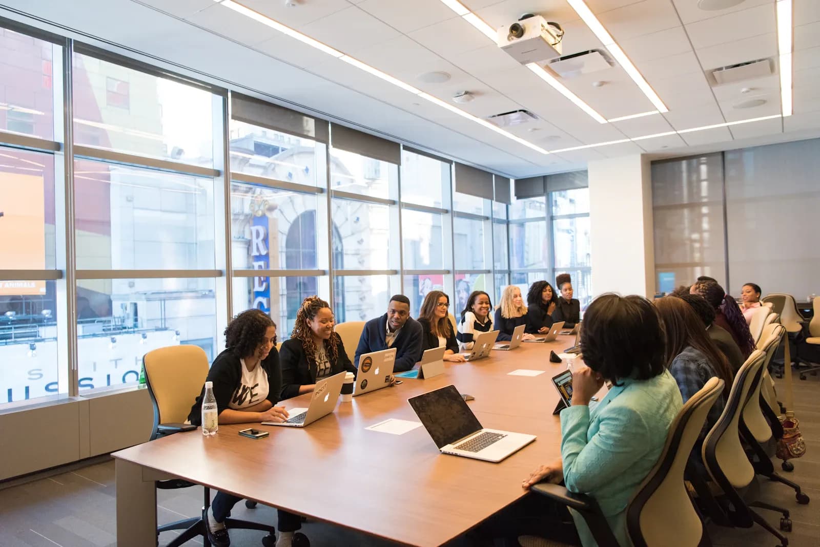 A team reviews vendor and third-party risk data together around a conference table